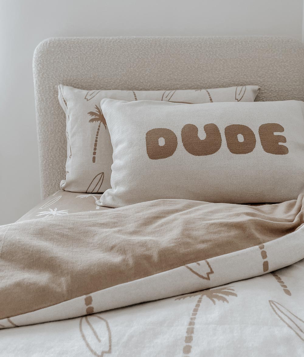 Kids bed styled with a natural Surfing Palm duvet cover, taupe quilt, DUDE pillowcase and palm print pillowcase