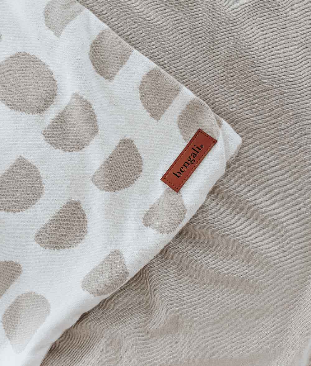 Corner of the Moon Phase jersey duvet cover with a leather Bengali label, on an oatmeal sheet