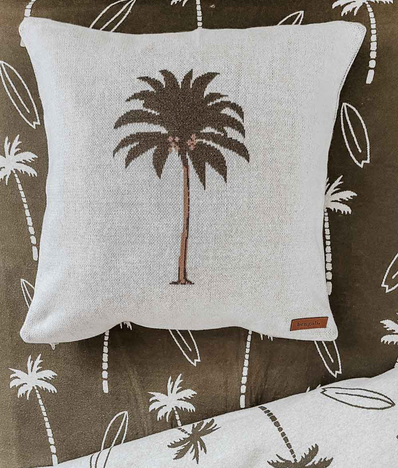 A PALM CUSHION COVER with a palm tree on it from Bengali Collections.