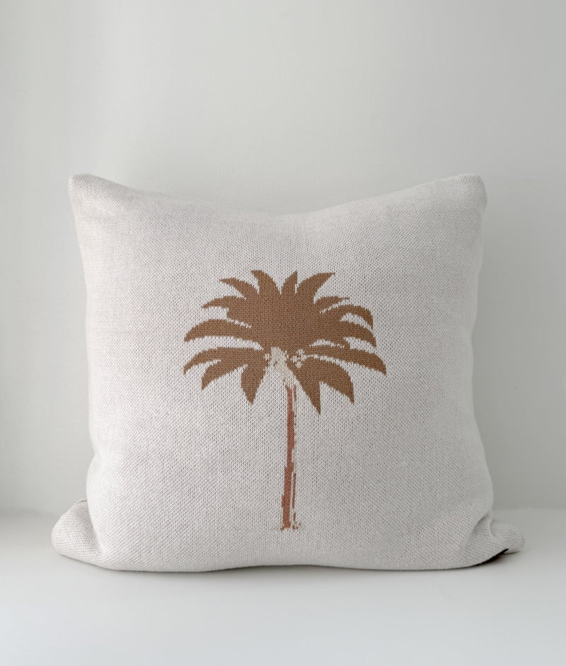 Khaki Palm cushion cover in ivory cotton with a hand-drawn khaki palm tree on a white backdrop