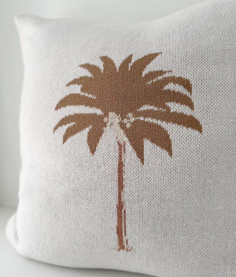 Close-up of the hand-drawn khaki palm tree on the ivory Khaki Palm cotton cushion cover