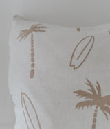 Close-up of the natural palm tree and surfboard print on the ivory euro pillowcase