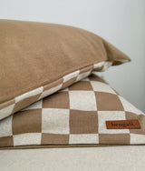 Khaki gingham check pillowcase stacked beneath a plain khaki pillow with the Bengali tab visible