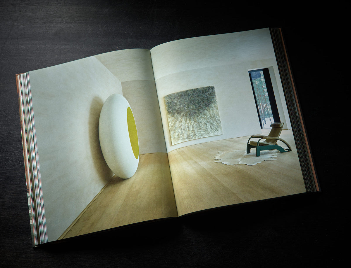 Axel Vervoordt Portraits of Interiors open spread showing a minimal gallery interior