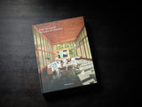 Axel Vervoordt Portraits of Interiors hardcover styled on a dark surface
