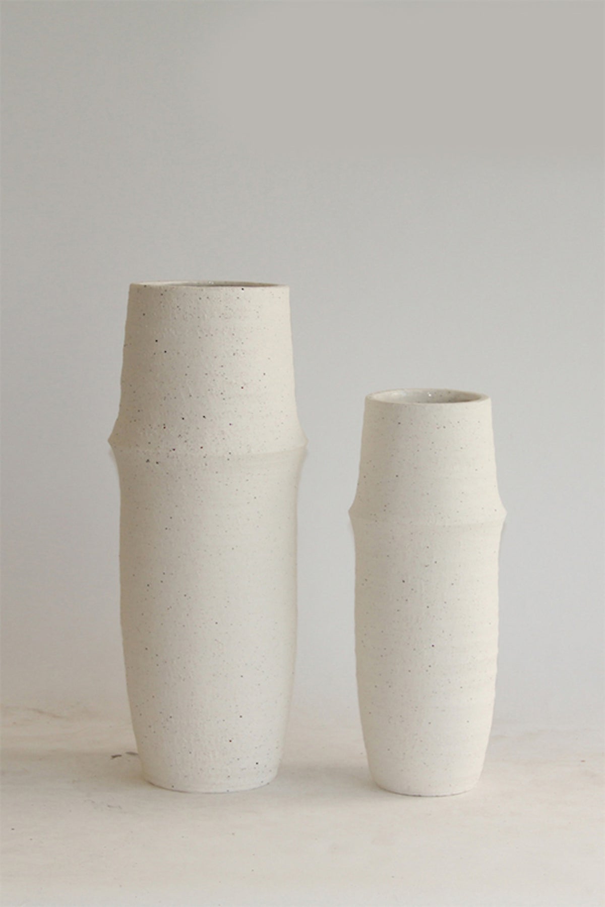 Soraya tapered ceramic vase in chalk, small and large sizes shown together