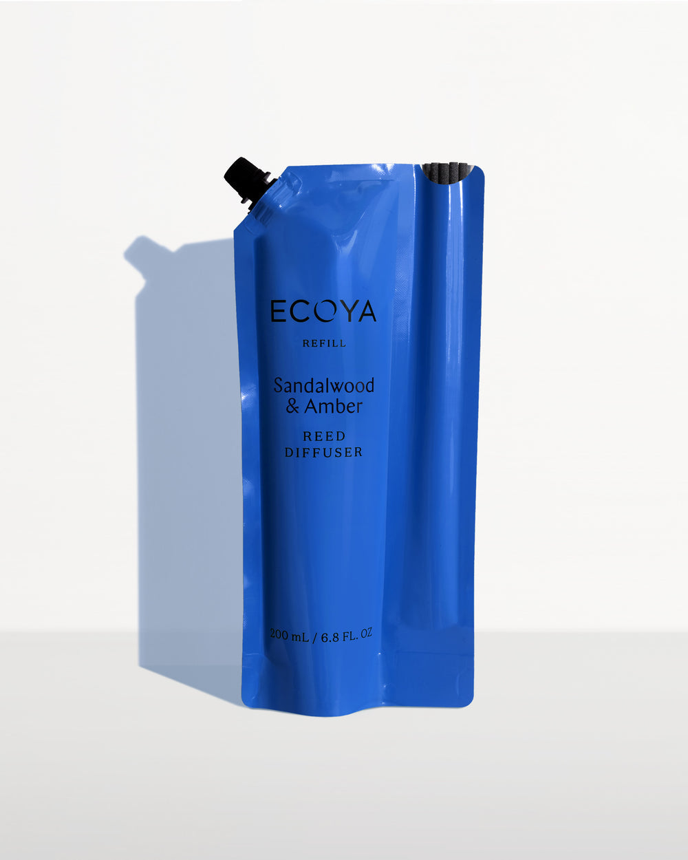 Ecoya Sandalwood and Amber reed diffuser refill pouch in blue packaging