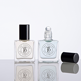Two bottles of CALYPSO perfume, inspired by Mango Skin (Vilhelm Parfumerie), sitting on a white surface. (Brand: The Perfume Oil Company)
