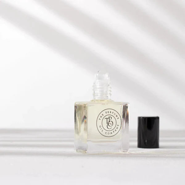 A small bottle of CALYPSO perfume inspired by Mango Skin, from Vilhelm Parfumerie, sitting on a white surface.