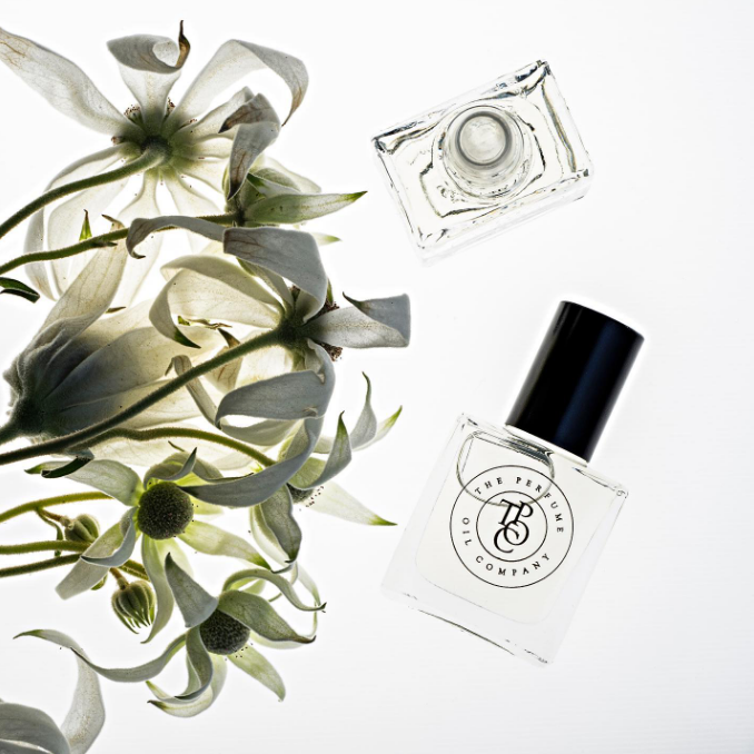 MIDNIGHT perfume oil by The Perfume Oil Company styled with a bouquet of flowers