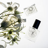 A beauty in a bottle, CALYPSO perfume from The Perfume Oil Company, a designer perfume oil inspired by Mango Skin (Vilhelm Parfumerie), paired with a bouquet of