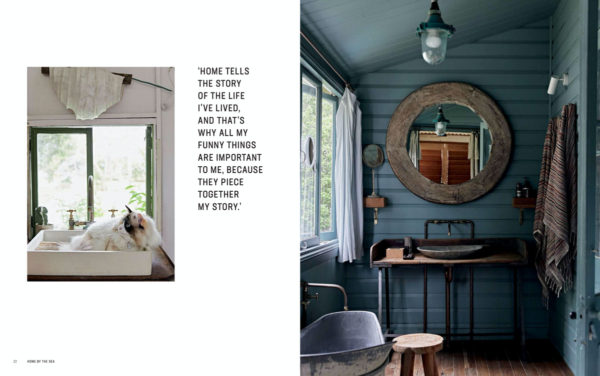 A magazine page featuring a creatively designed Home By The Sea bathroom with a sink and mirror, perfect for the Books interiors book.