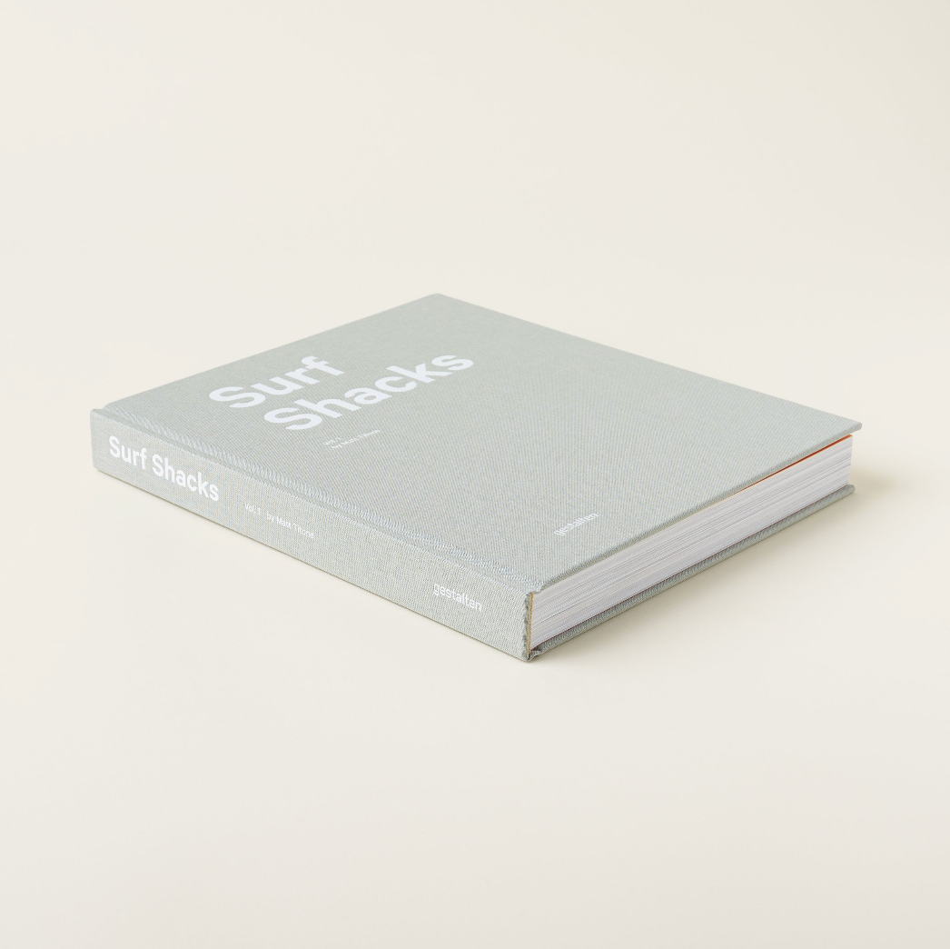 Surf Shacks book styled on a coffee table