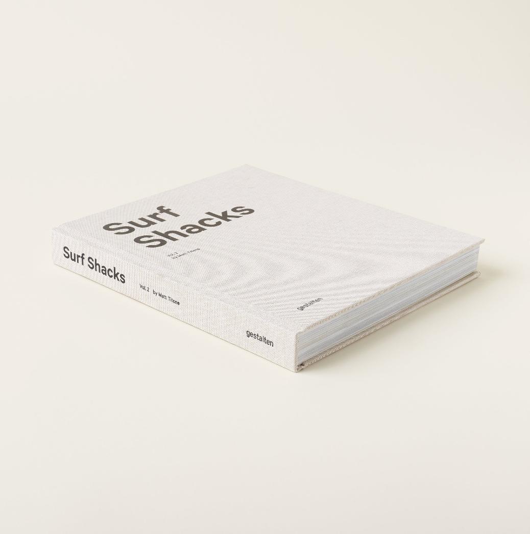 Surf Shacks Volume 2 lying at an angle on a cream background