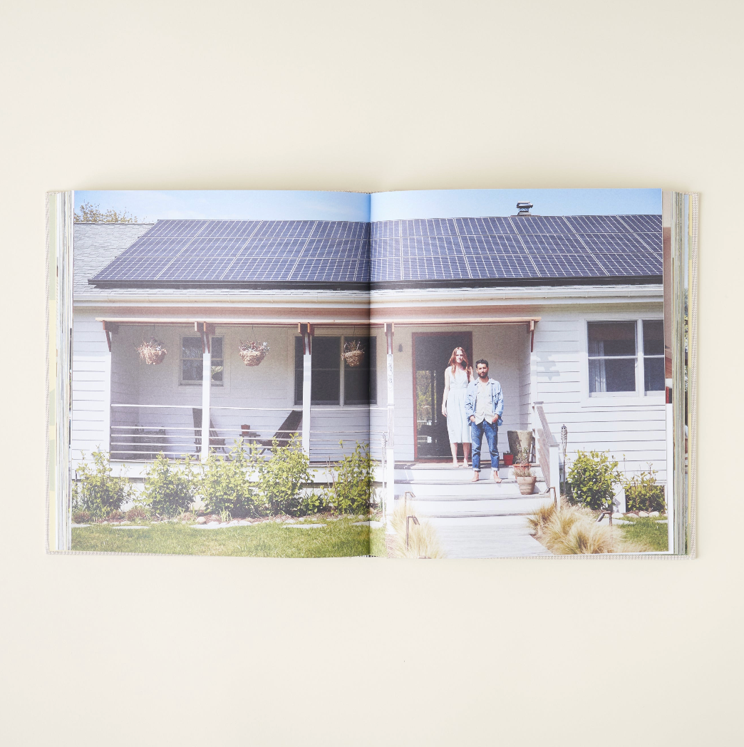 Spread with a family standing on the porch of a weatherboard house