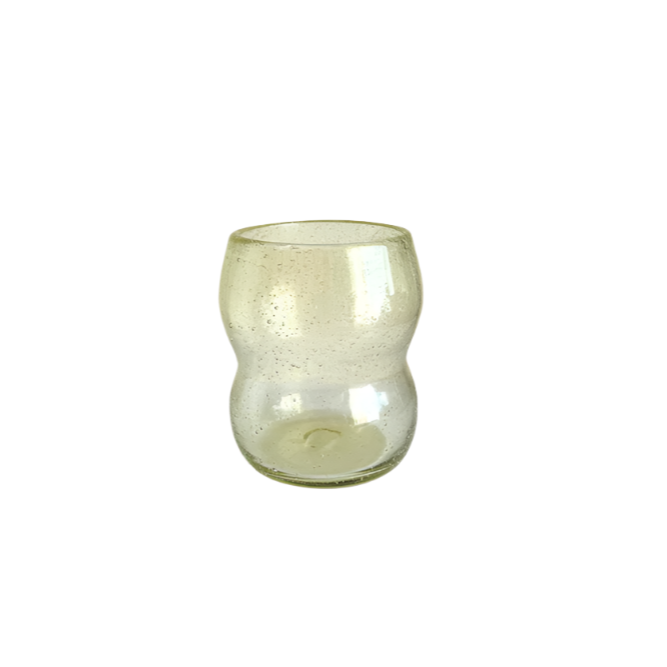 Como tumbler in light amber mouth blown glass with a pinched waist, on white