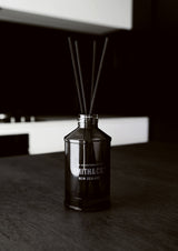 A black and white photo of a Smith & Co Diffuser - Lime & Coconut from The Aromatherapy Co.
