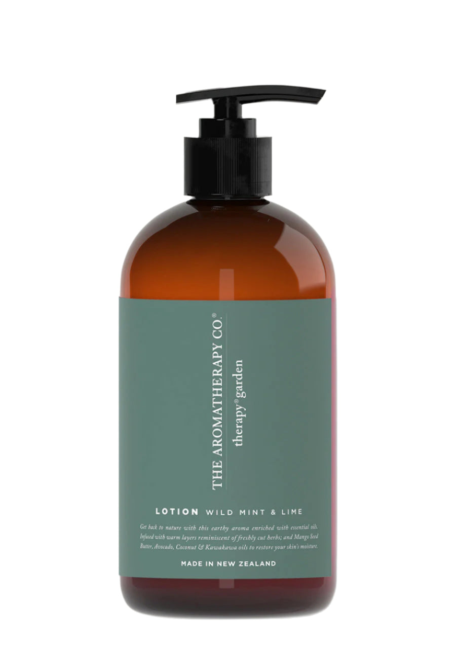 Sage green label reading Lotion Wild Mint & Lime on an amber Therapy Garden pump bottle, on white