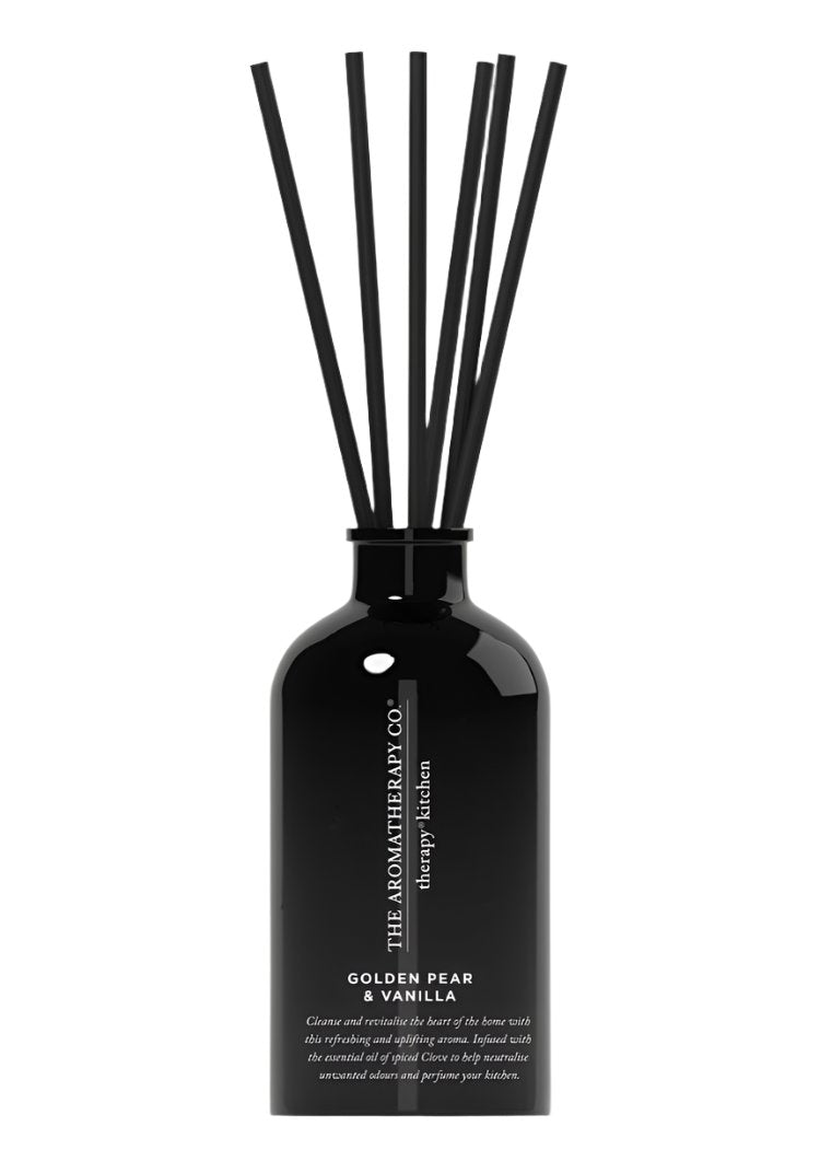 Therapy Kitchen Golden Pear & Vanilla reed diffuser in a black glass bottle with black reeds, on white