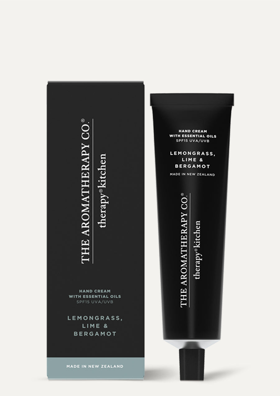 Lemongrass, Lime & Bergamot hand cream tube beside its black box on a pale background