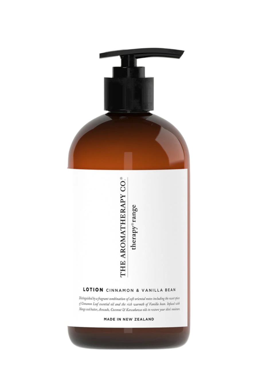 Amber pump bottle with a white label reading Lotion Cinnamon & Vanilla Bean, shown on white