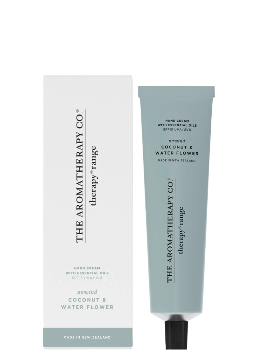 Therapy Unwind Coconut & Water Flower hand cream in a sage blue tube beside its white box