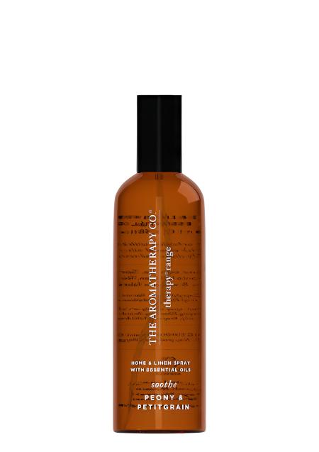 Therapy Soothe Peony & Petitgrain room and linen spray in an amber bottle on a white background