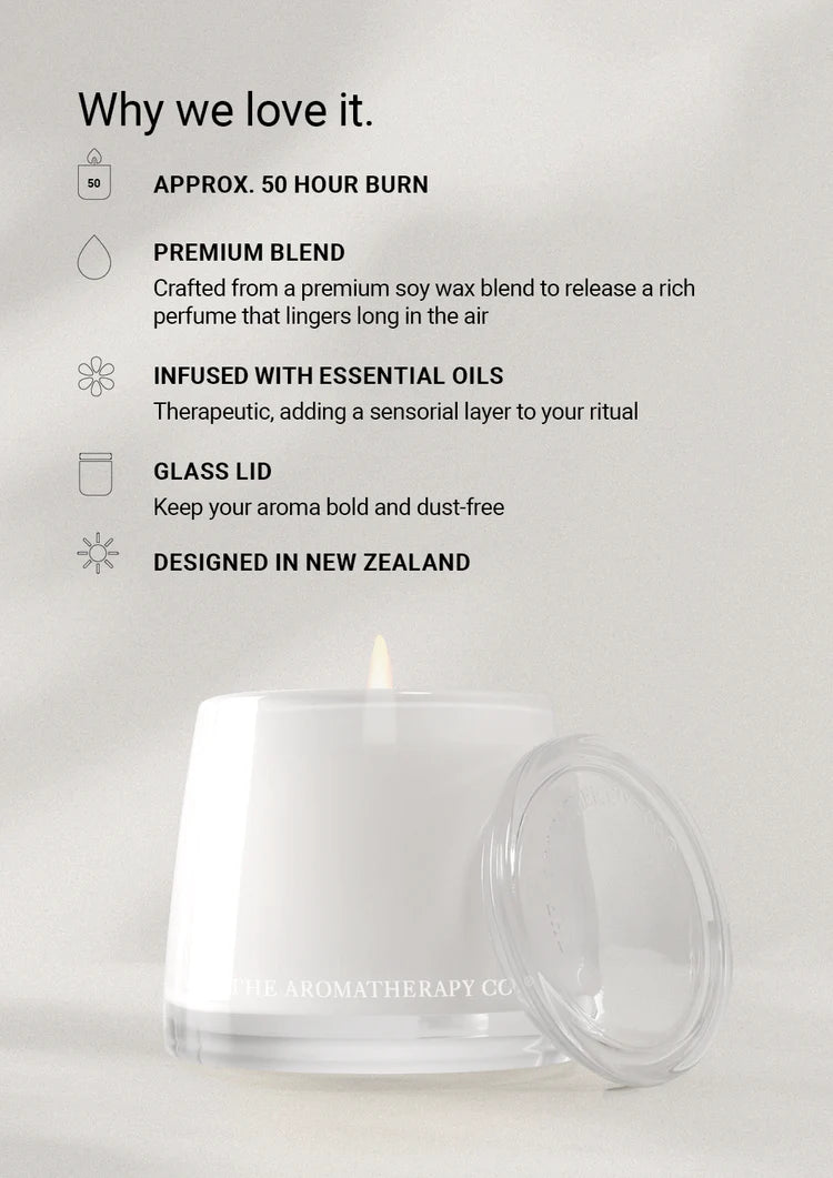 Why we love it feature card above a lit candle with its glass lid