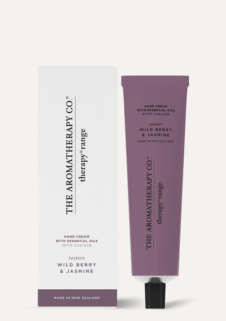 Therapy Wild Berry & Jasmine hand cream tube beside its white and plum box