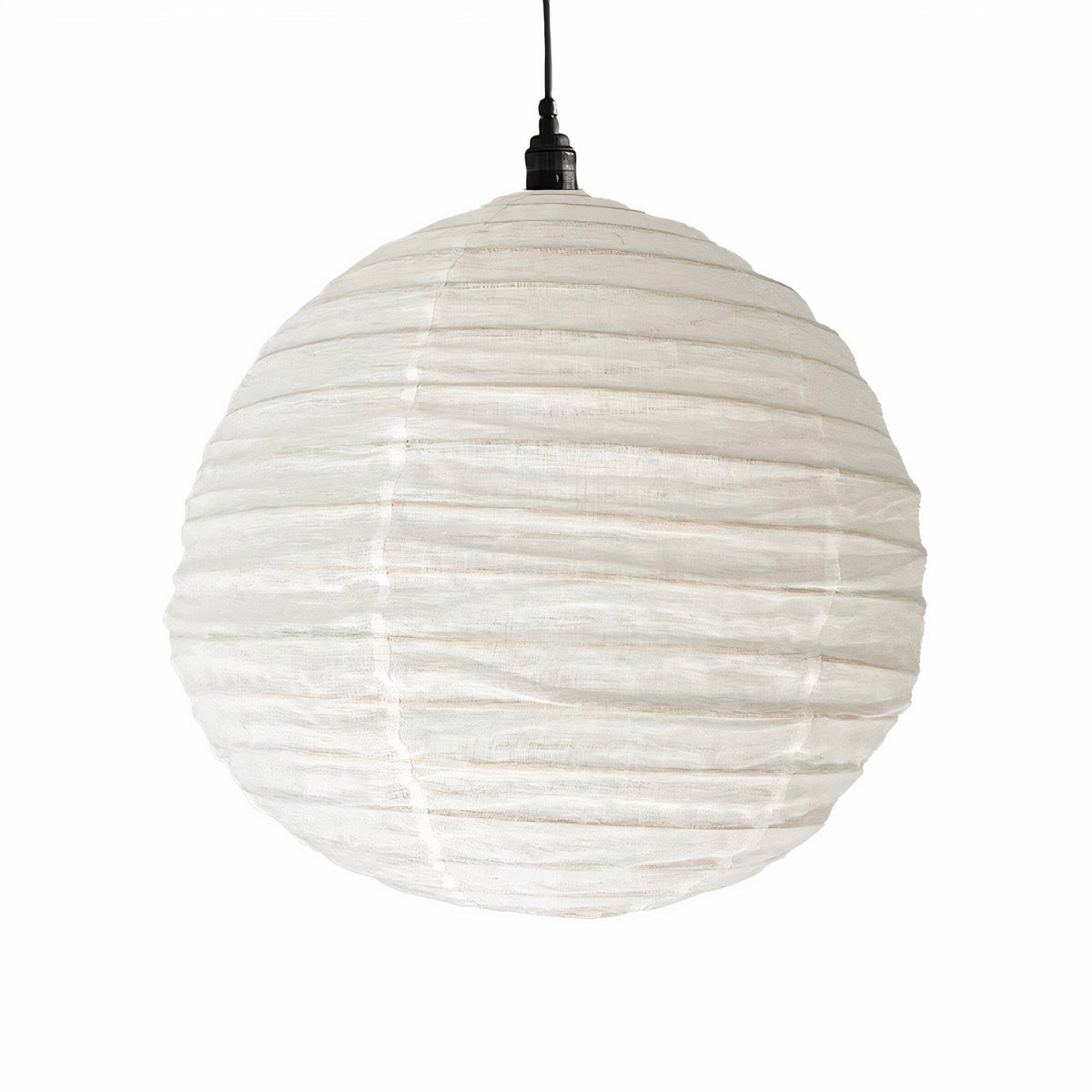 Round linen pendant shade in white, the ribbed globe hanging from a black cord