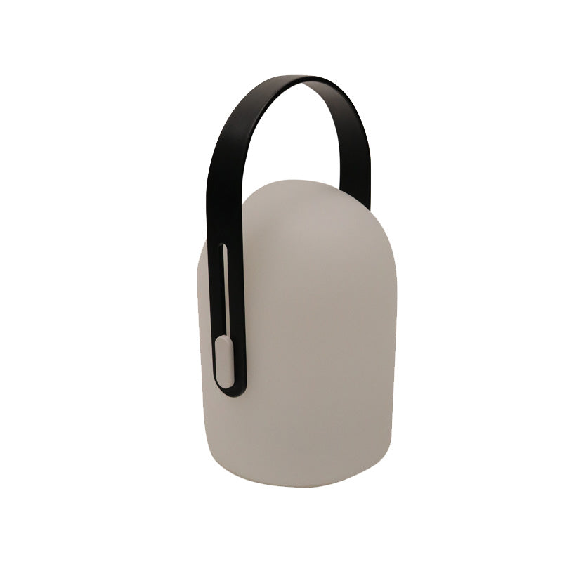Hampton LED lantern in taupe seen from an angle, showing the fold down handle