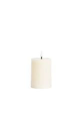 Small natural ivory LED wax pillar candle with flickering flame, 7.5 x 10 cm