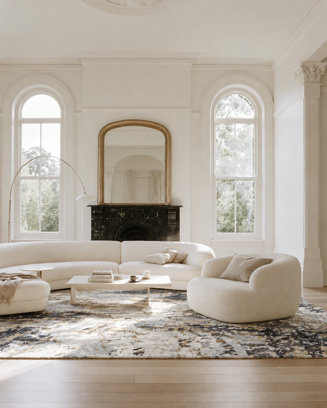 Alto Midnight Gold Rug in a villa lounge with a curved cream sofa, black marble fireplace and arched windows