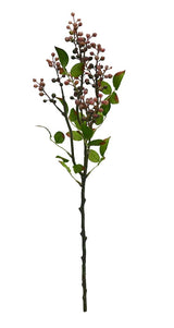 Artificial plant stem with leaves and small berries on a white background