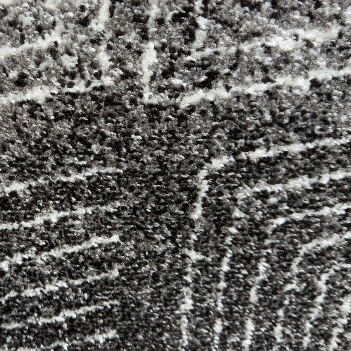 Close view of the charcoal pile with fine white lines
