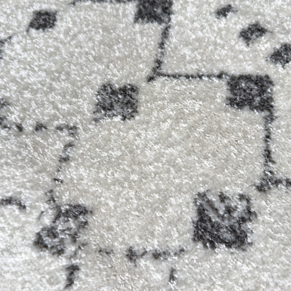 Close view of the grey motifs on the ivory pile