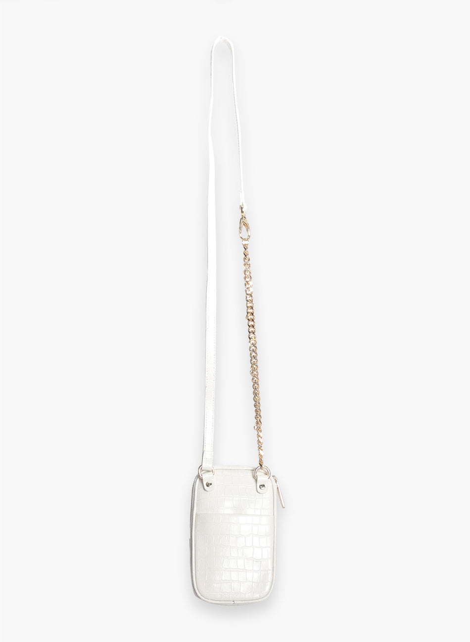 Attached To Me crossbody bag in ivory croc, back view with its long strap