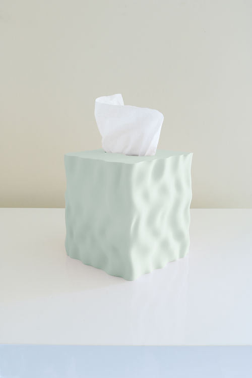A Flow Tissue Box made from recycled PLA plastic, sitting on top of a white table, produced by Utilize Studios.