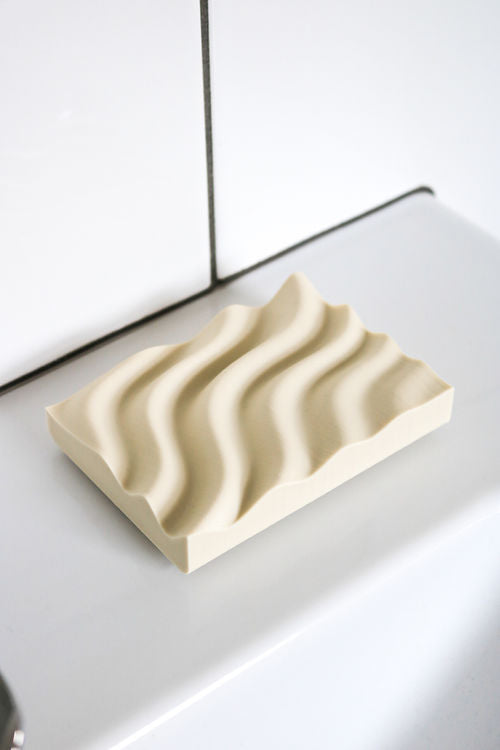 This Ripple Soap Tray soap dish is made from recycled PLA plastic and features a wave pattern. (Brand: Utilize Studios)