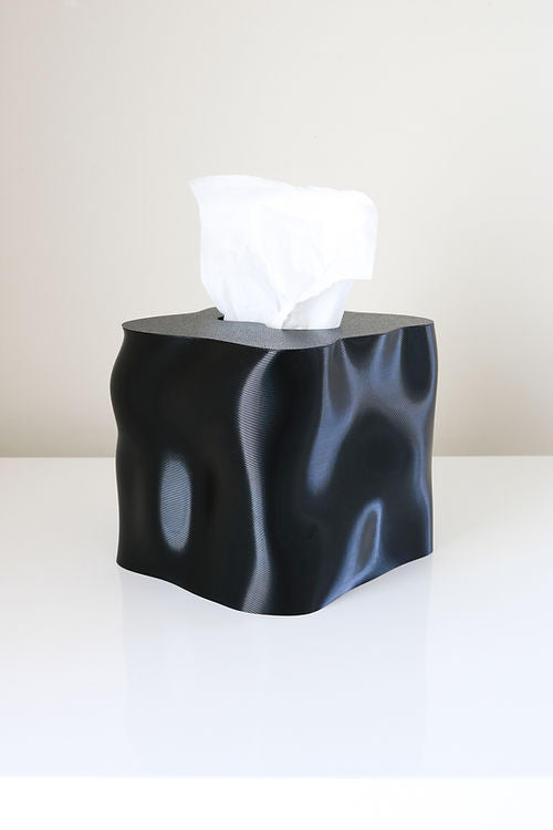 An innovative and eco-friendly Ebb tissue box, made from recycled materials, by Utilize Studios.