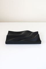 A 3D printed Tidal Tray made from recycled plastic, sitting on a white table. (Utilize Studios)