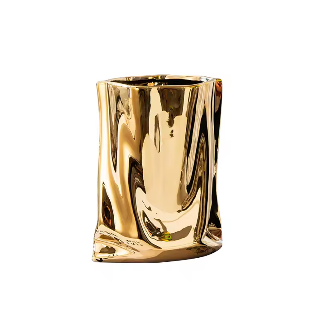 Metallic bag vase in gold, mirrored crinkle finish, on a plain background