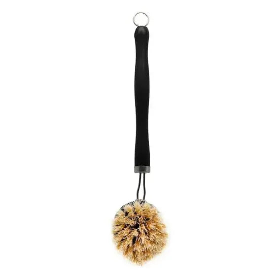 Black dish brush with sisal bristles hanging from its loop