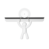 An image of a man holding a Buddy Squeegee White plate on a black background by Umbra.