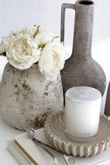 Caspian Rustic Vase with aged stone look, styled with white peonies and neutral ceramics on a console table