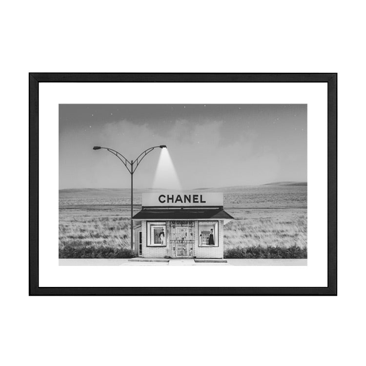 Chanel Shop black and white print in a black frame, on white