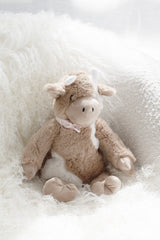 Daisy the Cow soft toy by Lily & George styled in a calm, Scandinavian-inspired nursery