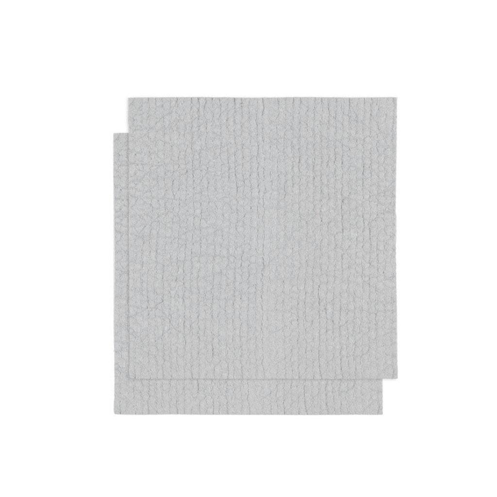 Swedish Dish Cloth in grey draped over the edge of a sink