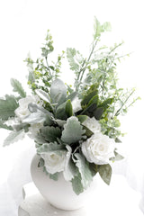 Artificial dusty miller spray with soft grey green leaves in white vase arrangement