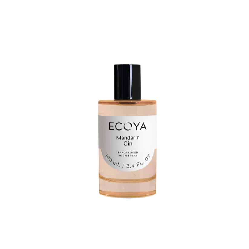 Ecoya room spray in a peach-tinted glass bottle with black cap on a white background